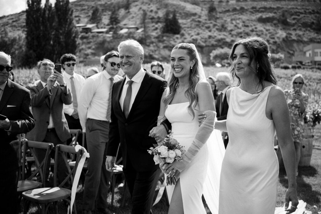 Outdoor wedding ceremony at Vows and Vines Vineyard overlooking Okanagan Lake in Penticton BC