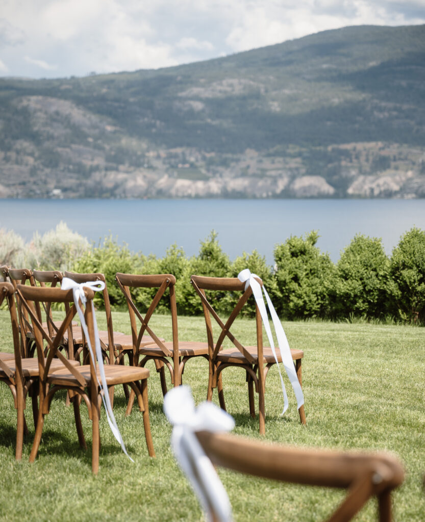 Outdoor wedding ceremony at Vows and Vines Vineyard overlooking Okanagan Lake in Penticton BC