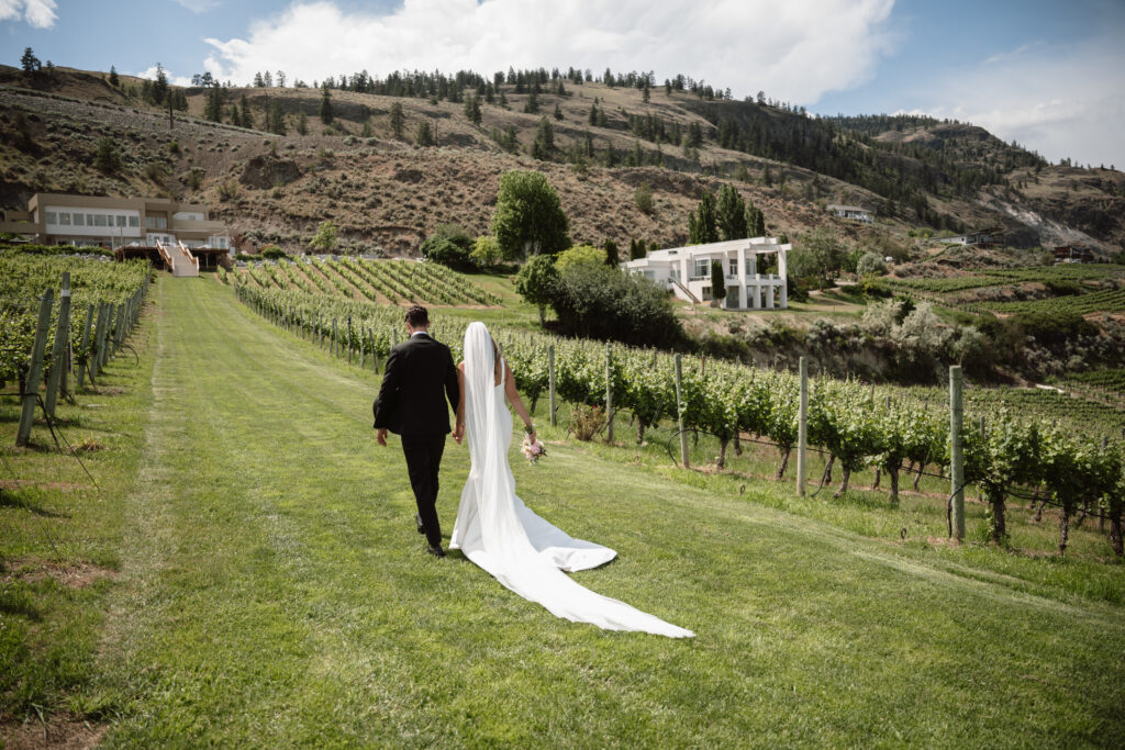 Outdoor wedding ceremony at Vows and Vines Vineyard overlooking Okanagan Lake in Penticton BC