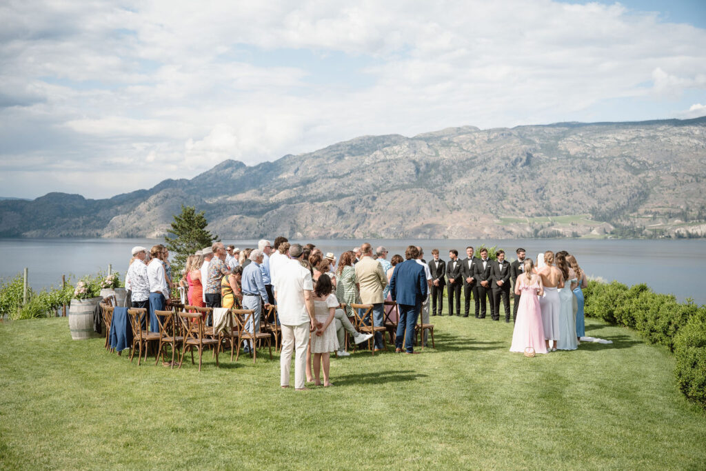 Outdoor wedding ceremony at Vows and Vines Vineyard overlooking Okanagan Lake in Penticton BC